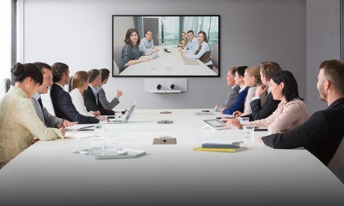 Conference room of employees engaged on a video call