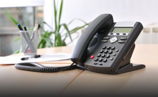 Desktop phone sitting on a desk