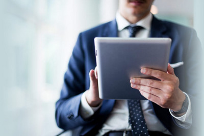 Man Working on Tablet